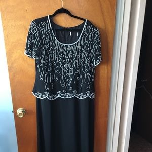 Black full length gown.  The top front is beaded.